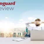 investor sitting in office and text stating "Vanguard review"