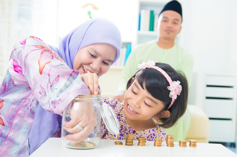 Family saving money in a coin jar